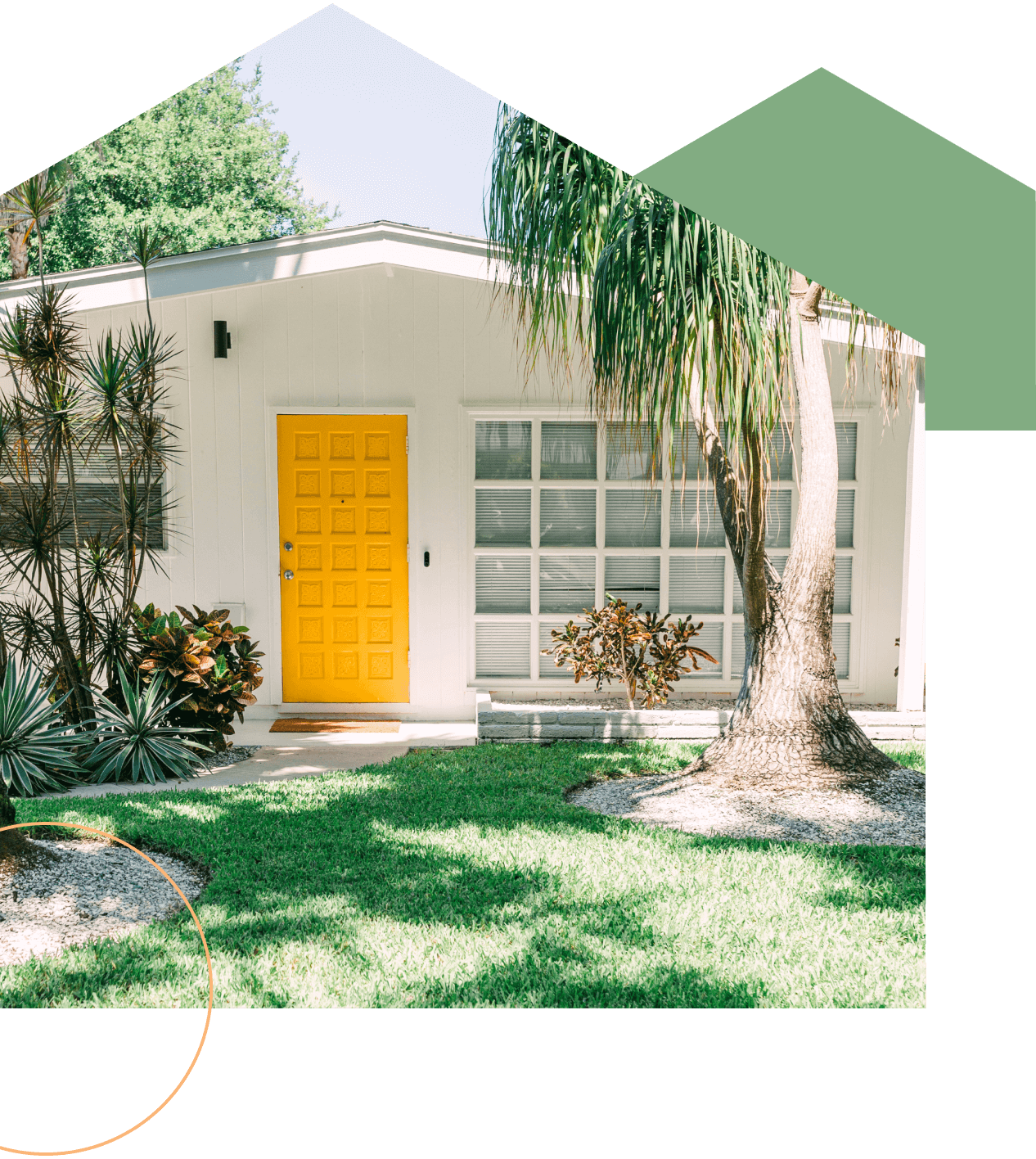 Florida home with a bright yellow front door and palm trees out front
